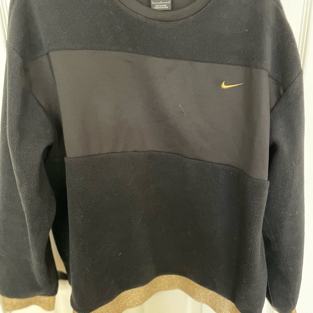 Nike Women's 2 piece Black and Gold Sweatshirt and jogging pants.